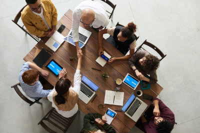 A photo of the Positive Planet team having a meeting